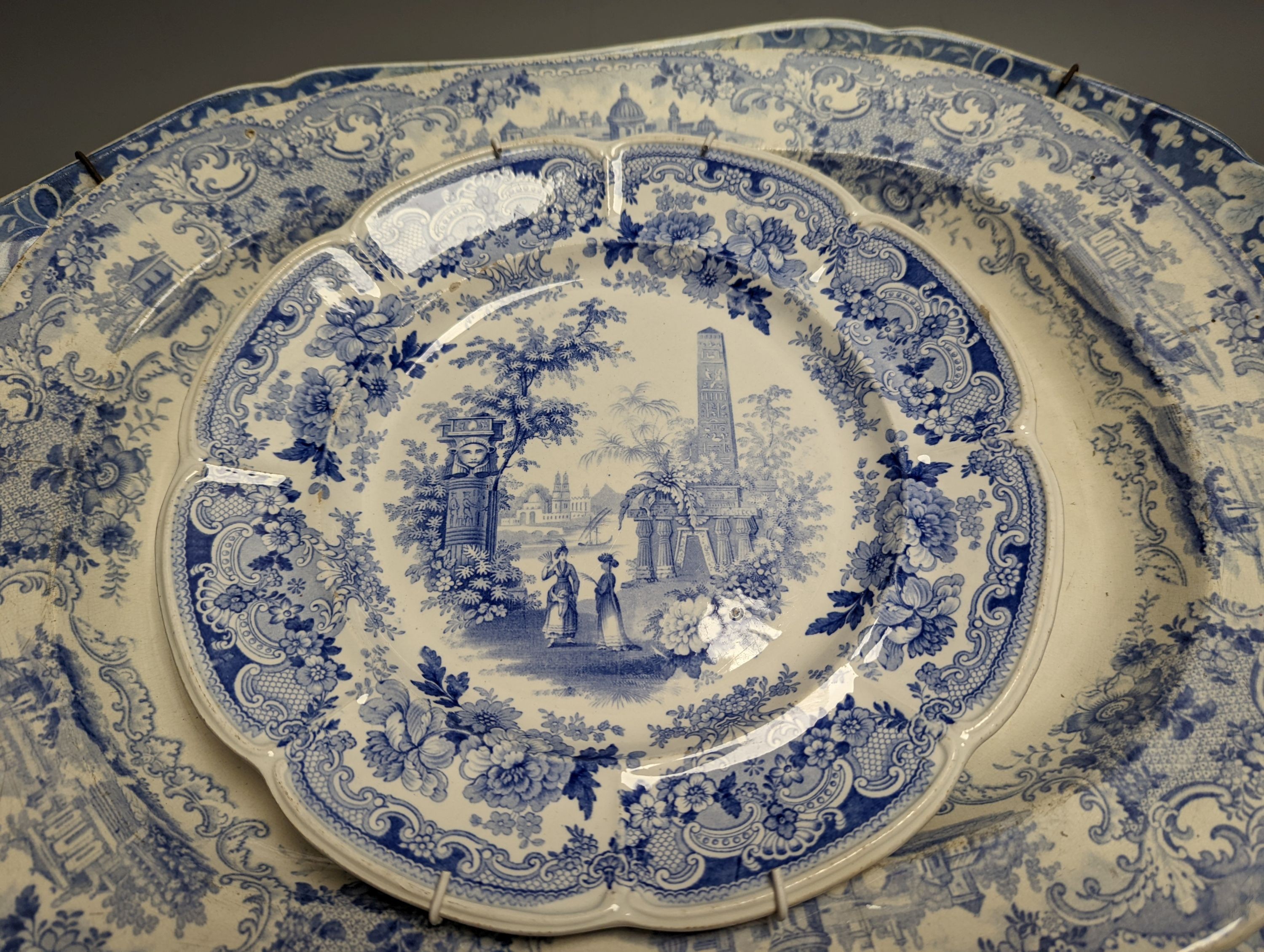 Two 19th century blue and white meat dishes and three similar plates, largest platter 49cms wide